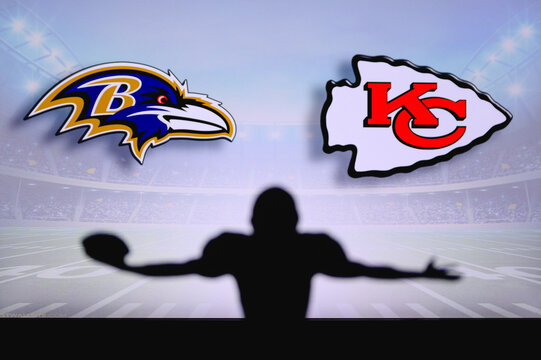 Baltimore Ravens vs. Kansas City Chiefs . NFL Game. American Football League match. Silhouette of professional player celebrate touch down. Screen in background.
