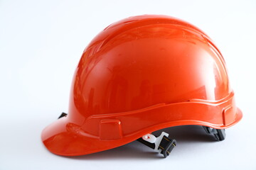 Fototapeta premium Red construction helmet shot isolated on white