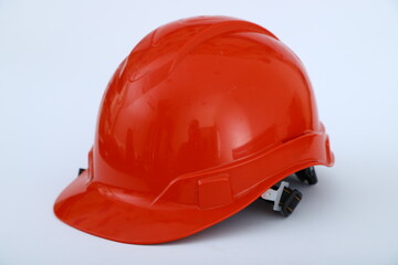 Red construction helmet shot isolated on white