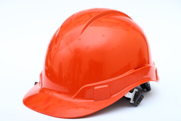 Fototapeta premium Red construction helmet shot isolated on white