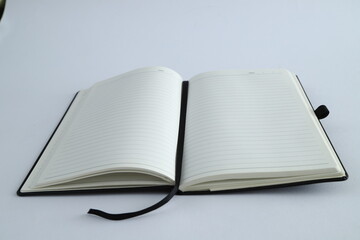 Business concept - sliver laptop with Top view collection of black fly black notebook front, back and white open page, 
