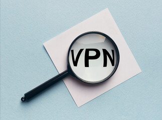 VPN Virtual Private Network word acronym on sticky notes paper with magnifying searching glass