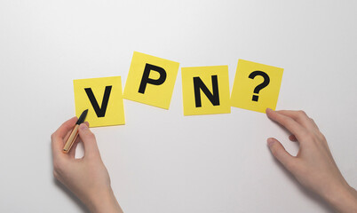 VPN Virtual Private Network word acronym on yellow sticky notes paper