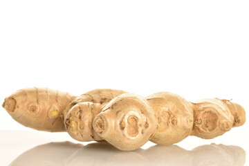 Fresh ginger root, close-up, isolated on white.