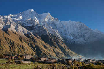 View of Kutang Himal range with Khayang & Saula Himal peaks, above Shayala village below, a typical tibetan village, Manaslu Circuit trek, Manaslu Himal, Gorkha district, Nepal Himalaya, Nepal.