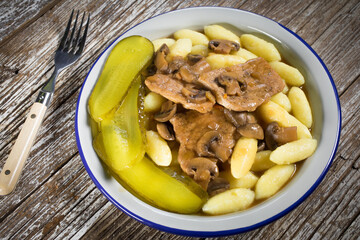 Braised pork loin with mushrooms.
