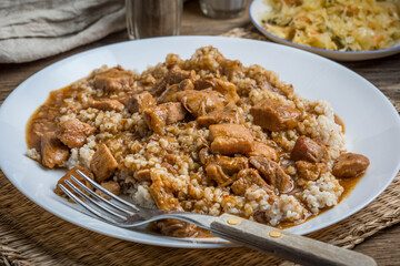 Barley groats with stewed meat.