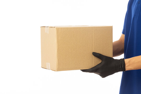 Delivery Man Holding Cardboard Boxes In Rubber Gloves Isolated