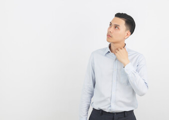 Young handsome asian business man thinking an idea while looking up isolated on white background.