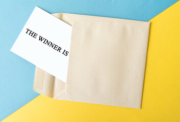The winner is text with an envelope, competition and prize concept  - 364116639