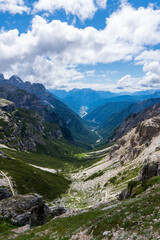 Fototapeta na wymiar Fantastic views down the Dolomites mountain valley at the start of Tre Cime di Lavaredo loop hike in Parco Naturale Tre Cime, South Tyrol, Italy