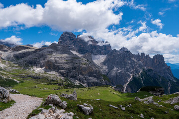 Fototapeta na wymiar Amazing rocky mountains covered with clouds, Tre Cime di Lavaredo park, Dolomites, Italy
