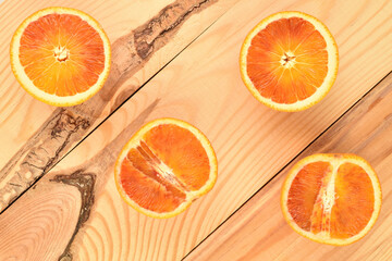 Sweet juicy organic orange, close-up, on a wooden table.