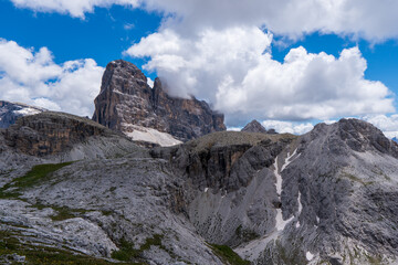 Fototapeta na wymiar Amazing rocky mountains covered with clouds, Tre Cime di Lavaredo park, Dolomites, Italy