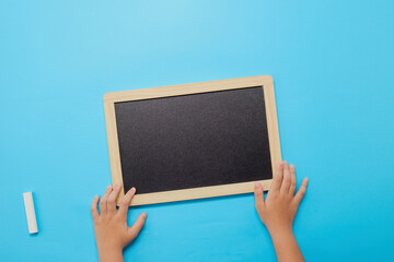 Back to school background, Chalk and hands holding blackboard