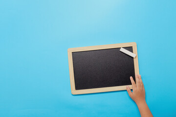 Back to school background, Chalk and hands holding blackboard