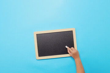 Back to school background, Chalk and hands holding blackboard