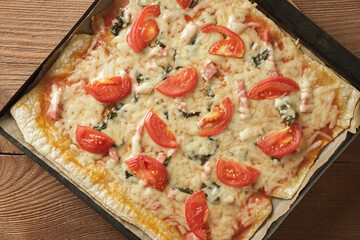 Homemade traditional italian pizza, tomato, mozzarella cheese, bacon.