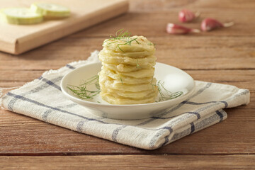 Delicious fried zucchini with dill and garlic.