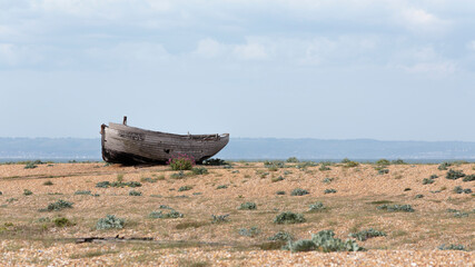 The hull of an abandoned fishing boat on Dungeness beach