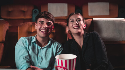 People audience watching movie in the movie theater cinema. Group recreation activity and...