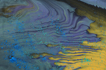 art photography of abstract marbleized effect background. Gold and purple, black, green creative colors. Beautiful paint.