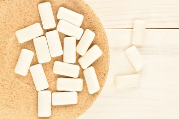 Chewing gum, close-up, on a wooden table.