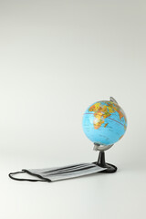 The world simulation with medical mask for stopping the spread of virus on white background. Concept fight against virus.