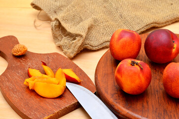 still life with fruit nectarines in the kitchen fresh peaches on wooden table 