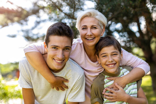 Happy Mother With Her Two Sons
