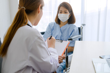 Female doctor writing report