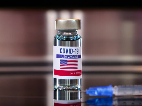 Vial of covid-19 vaccine with a flag label of USA