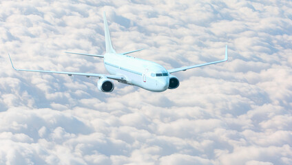 White passenger airplane in the clouds  - Travel by air transport