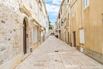 Croatia, beautiful old cobbled street, traditional houses and in the old historical town of Pag
