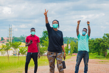 group of africans wearing face mask to prevent, preventing, prevented themselves from the outbreak...