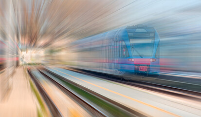 Fototapeta na wymiar High speed train runs on rail tracks . Train in motion