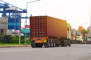 Container red truck in ship port Logistics.Transportation industry in port business concept.import,export logistic industrial Transporting Land transport freight warehouse storge