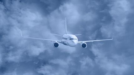 Commerical airplane flying under the storm clouds