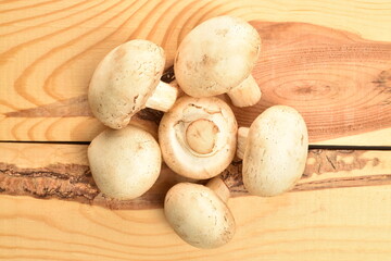 Freshly cut mushrooms, close-up, on a wooden table.