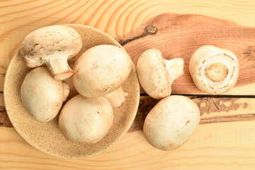 Freshly cut mushrooms, close-up, on a wooden table.