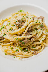 Pasta with meatballs, marinara sauce, Parmesan cheese and fresh Italian parsley. Classic American or Italian restaurant favorite. Homemade pasta with sauces, meats and cheeses.