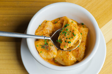 Pasta with meatballs, marinara sauce, Parmesan cheese and fresh Italian parsley. Classic American or Italian restaurant favorite. Homemade pasta with sauces, meats and cheeses.