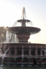 fountain in the sunset. Water fountain isolated.