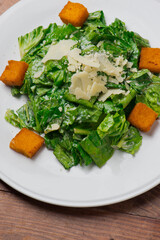 Salad. Classic American or French restaurant salad made w/ kale, Arugula, almonds, blueberries, walnuts, tomatoes, bacon, blue cheese, avocado, tossed w/ olive oil.