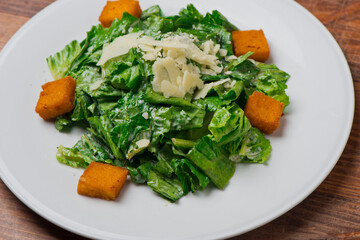 Salad. Classic American or French restaurant salad made w/ kale, Arugula, almonds, blueberries, walnuts, tomatoes, bacon, blue cheese, avocado, tossed w/ olive oil.