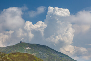 Mountain peak Popivan (Pip Ivan, Pop Iwan) with abandoned old observatory building on top in rainy...