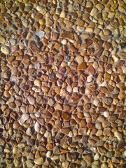 Custom masonry walls made of sand and small stones.