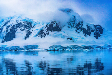 Fototapeta na wymiar Blue Glacier Snow Mountains Reflection Paradise Bay Skintorp Cove Antarctica