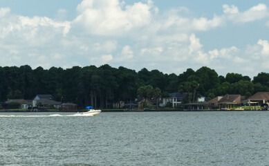 Boat riding across Lake Conroe