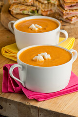 Tomato Soup. Homemade tomato soup topped with feta cheese and paired with mini grilled cheese sandwiches. Traditional classic American lunch favorite. 